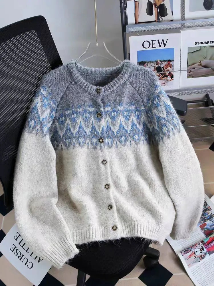Women's thick jacquard knit sweater coat in a loose fit, shown in milky white colour with long sleeves.