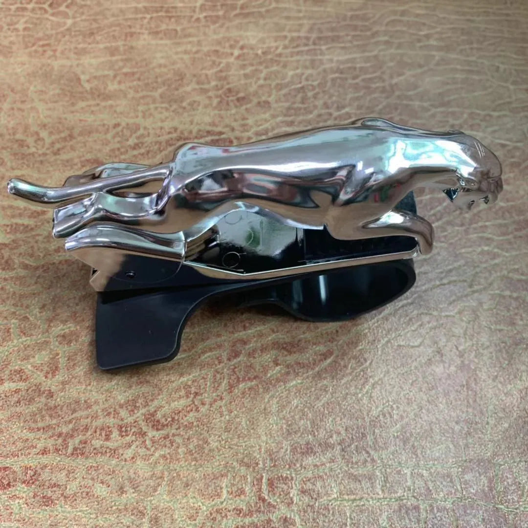 Black car phone holder with rotating bracket mounted on a windscreen