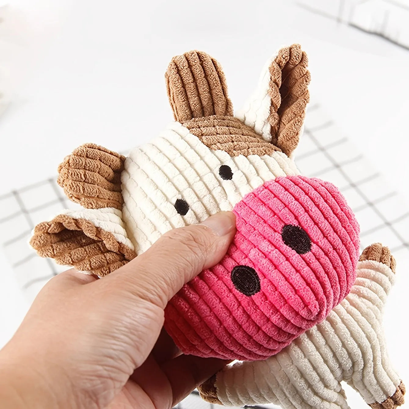 Animal-shaped plush dog chew toy in bright colours with squeaker for small medium dogs