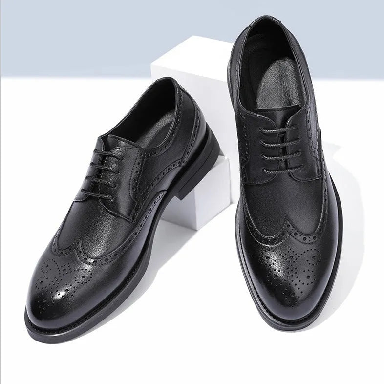 Men's black brogue leather shoes with traditional perforations and Oxford-style construction
