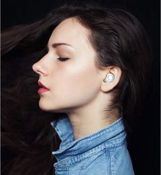 Black and white M18 true wireless in-ear stereo headphones with charging case.