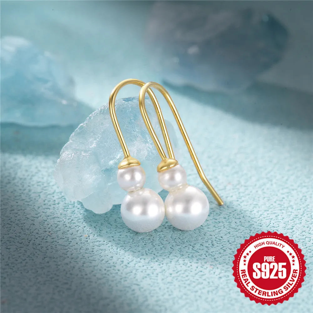 S925 sterling silver earrings with a geometric sunflower design and golden zircon inlay.