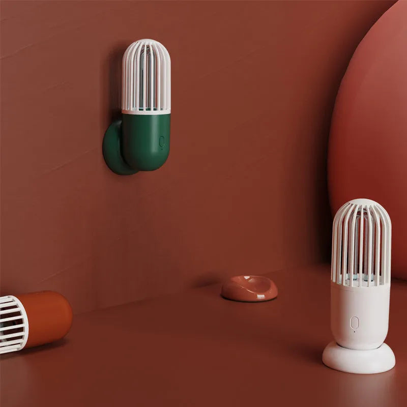 Portable capsule ultraviolet disinfection lamp in black, brown, green or white with compact 52x52x136mm body