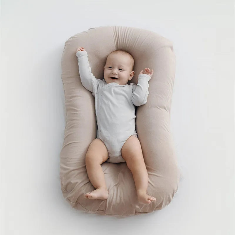 Portable cotton baby nest crib measuring 75x45cm with PP cotton filler in beige colour