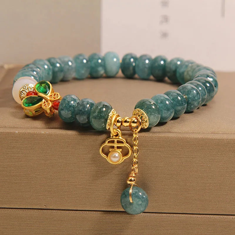 Blue water jade abacus beads crystal bracelet with white agate and rhinestone accents on alloy