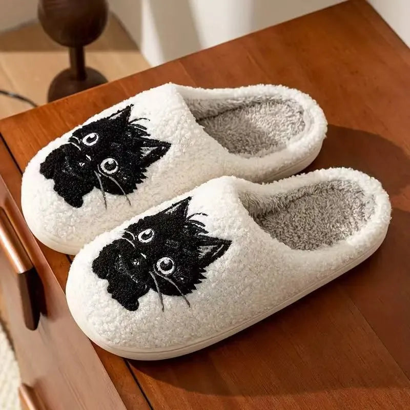 White plush cotton couple slippers with black cat cartoon design and non-slip TPR soles