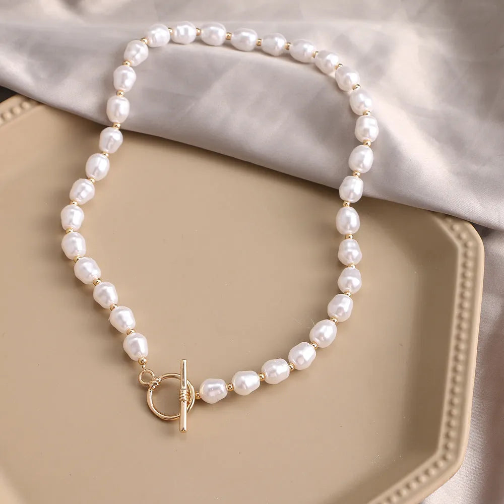 Vintage gold necklace with heart pendant on pearl-style chain, adjustable 41-50cm length
