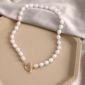 Vintage gold necklace with heart pendant on pearl-style chain, adjustable 41-50cm length