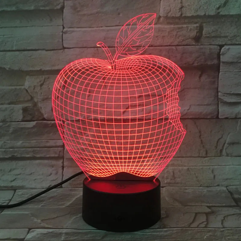 3D fruit-shaped colourful night light with touch controls and acrylic shade on a surface.