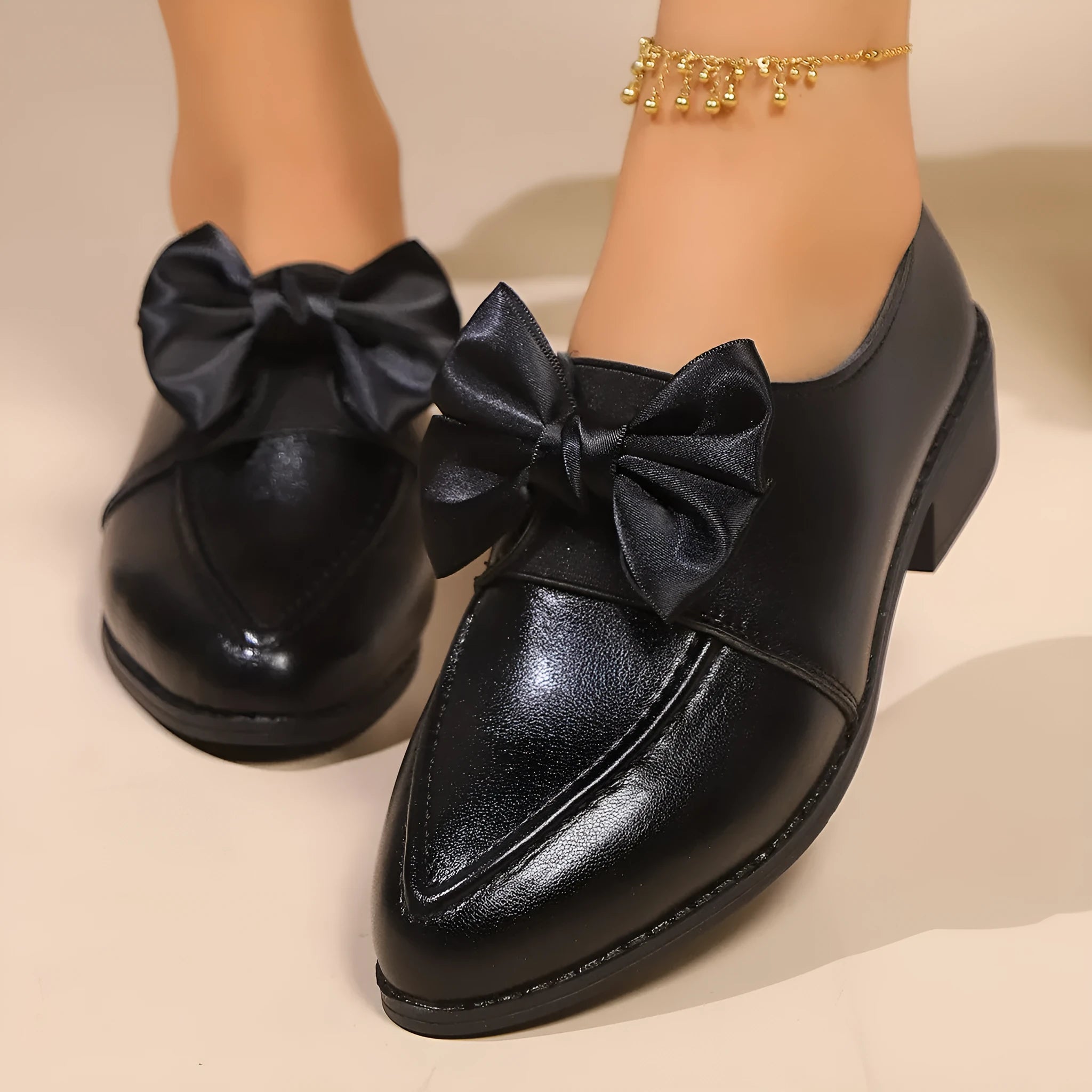 Women's British-style leather shoes with decorative bow on pointed toe, available in three bow style variations