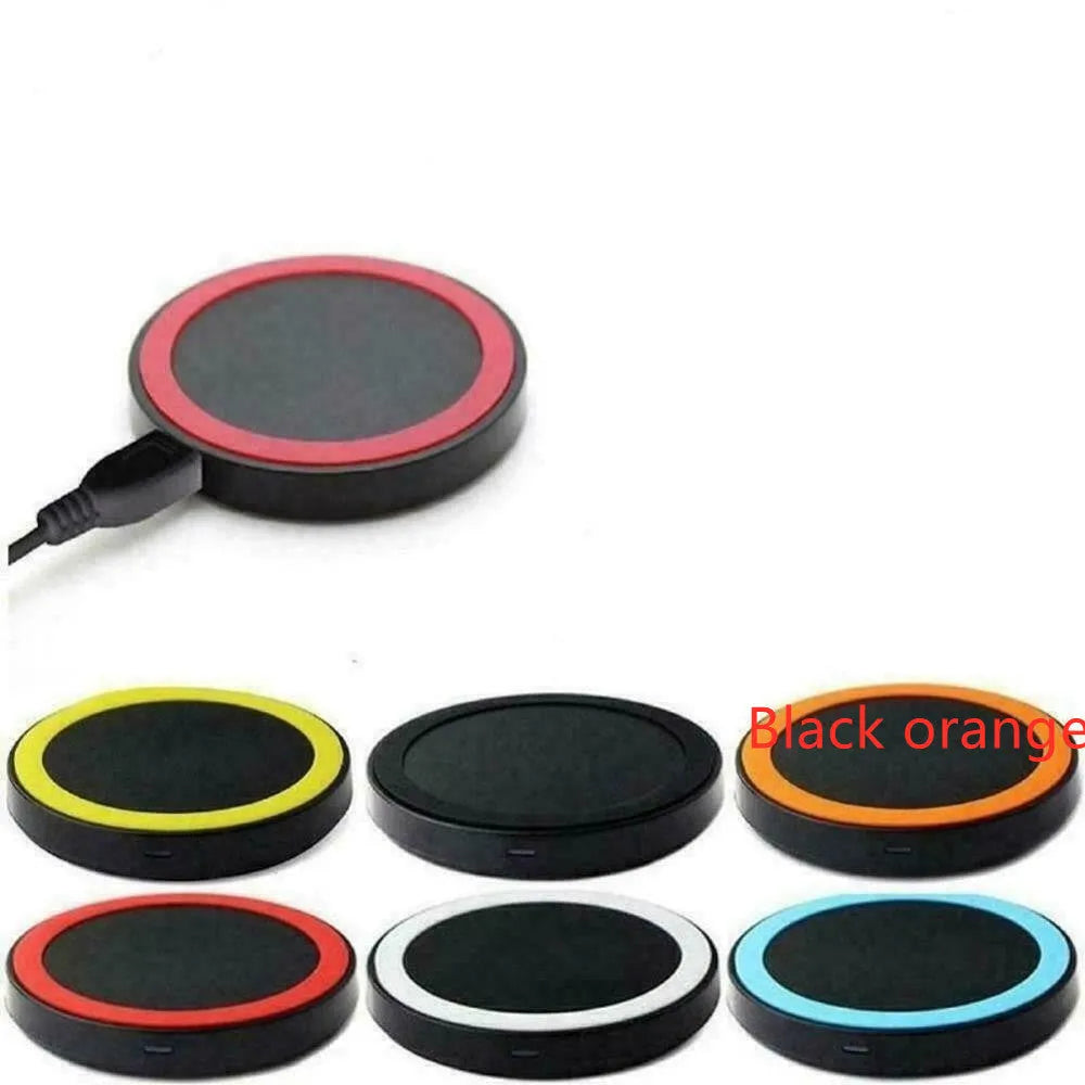 Square Qi wireless charging pad for mobile phones in multiple colours on a desk.