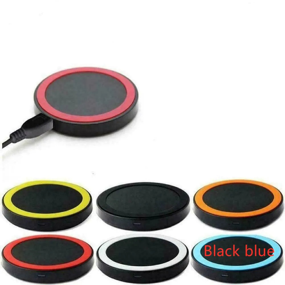 Square Qi wireless charging pad for mobile phones in multiple colours on a desk.