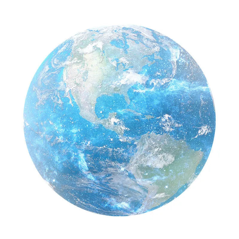 Round planet pattern laptop cushion on wooden desk