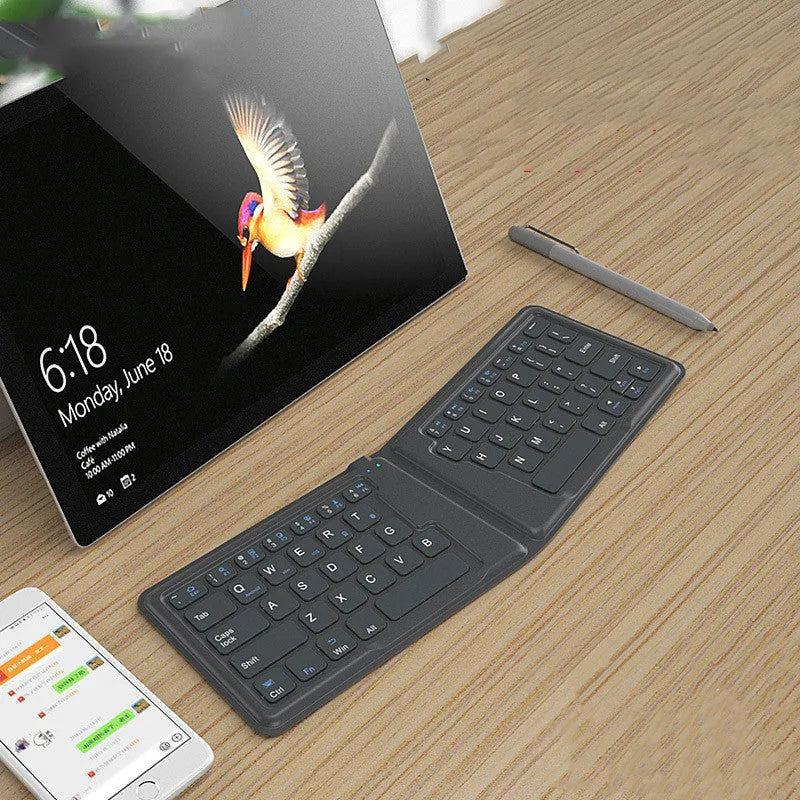 Folding Bluetooth keyboard with 64 keys X architecture ABS material USB charging for iPad tablet phone