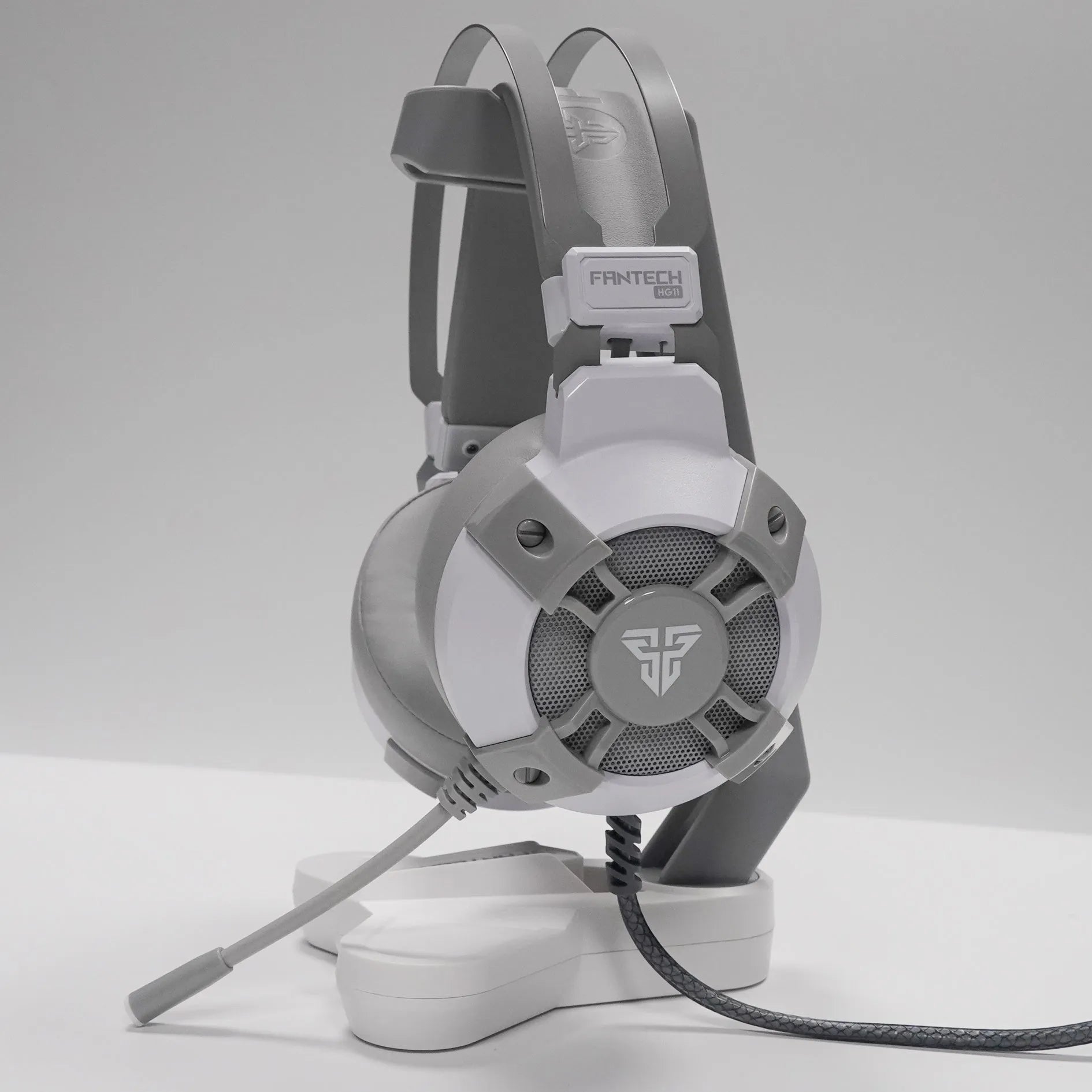 Black FANTECH HG11 USB gaming headset with RGB lights and an inline remote control on the cable.