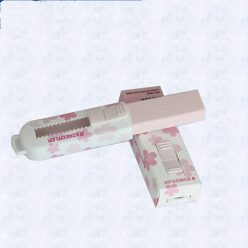 Square pink push-pull student eraser with replaceable core for whiteboards.