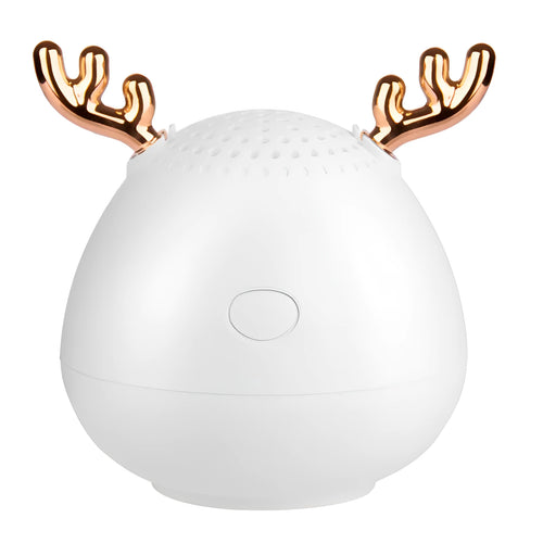 Small green portable Bluetooth speaker with USB charging port on a white background.