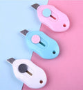 Cartoon character art knife with plastic handle and metal blade for manual production