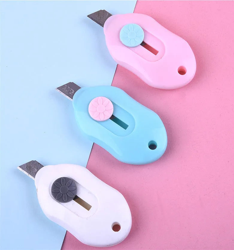 Cartoon character art knife with plastic handle and metal blade for manual production