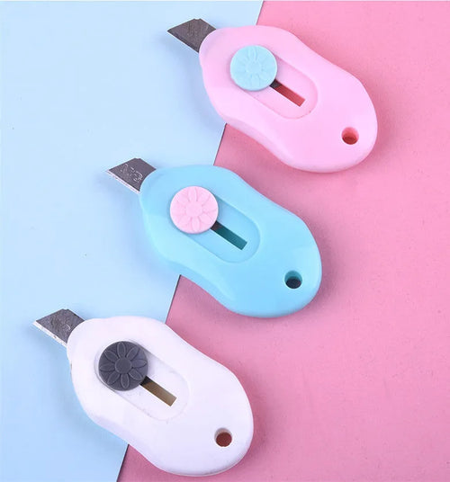 Cartoon character art knife with plastic handle and metal blade for manual production