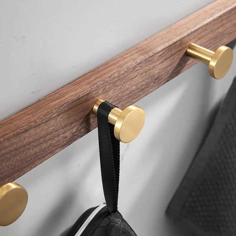 Black walnut style aluminum clothes hooks with brass finish in a row, showing 3, 4, 5, and 6-hook style options.
