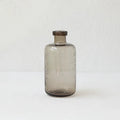A grey geometric bubble glass decorative vase with a textured stained glass surface.