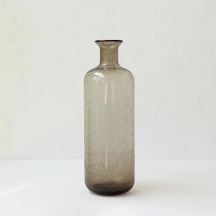 A grey geometric bubble glass decorative vase with a textured stained glass surface.