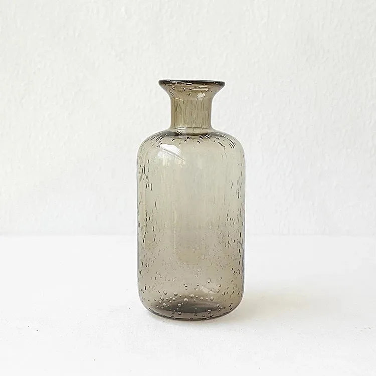 A grey geometric bubble glass decorative vase with a textured stained glass surface.