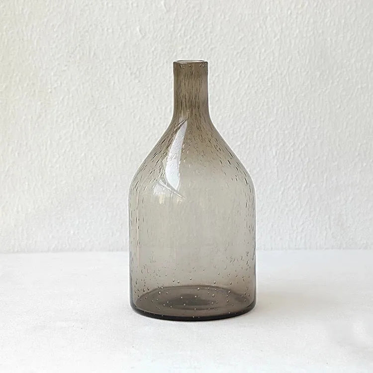 A grey geometric bubble glass decorative vase with a textured stained glass surface.