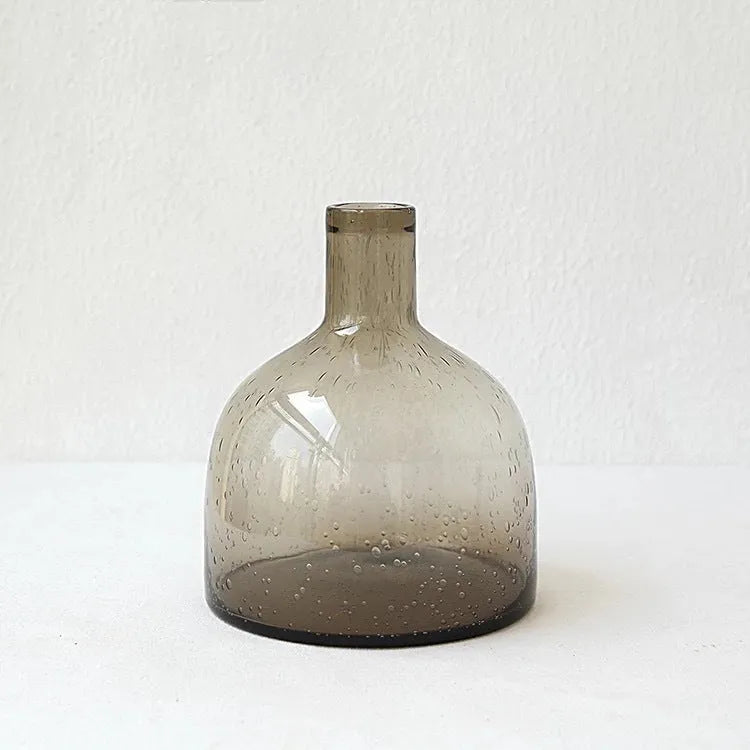 A grey geometric bubble glass decorative vase with a textured stained glass surface.