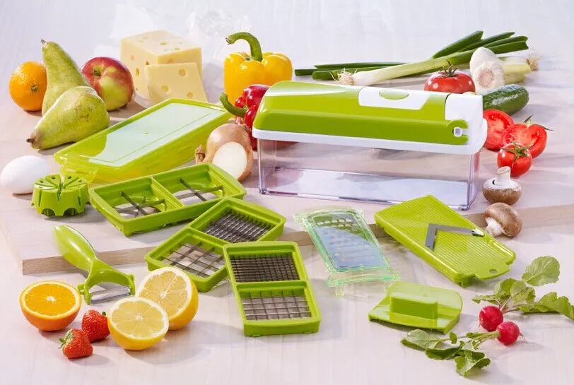 Green 12-piece manual vegetable chopper set with stainless steel blades on a kitchen counter.