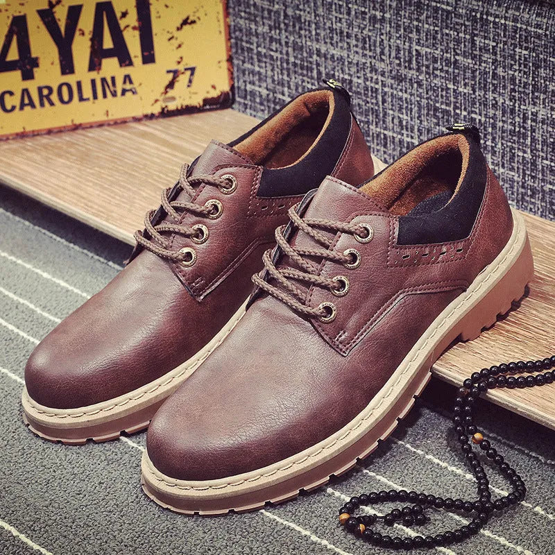 Men's black casual shoes with lace-up front and round toe design on rubber sole