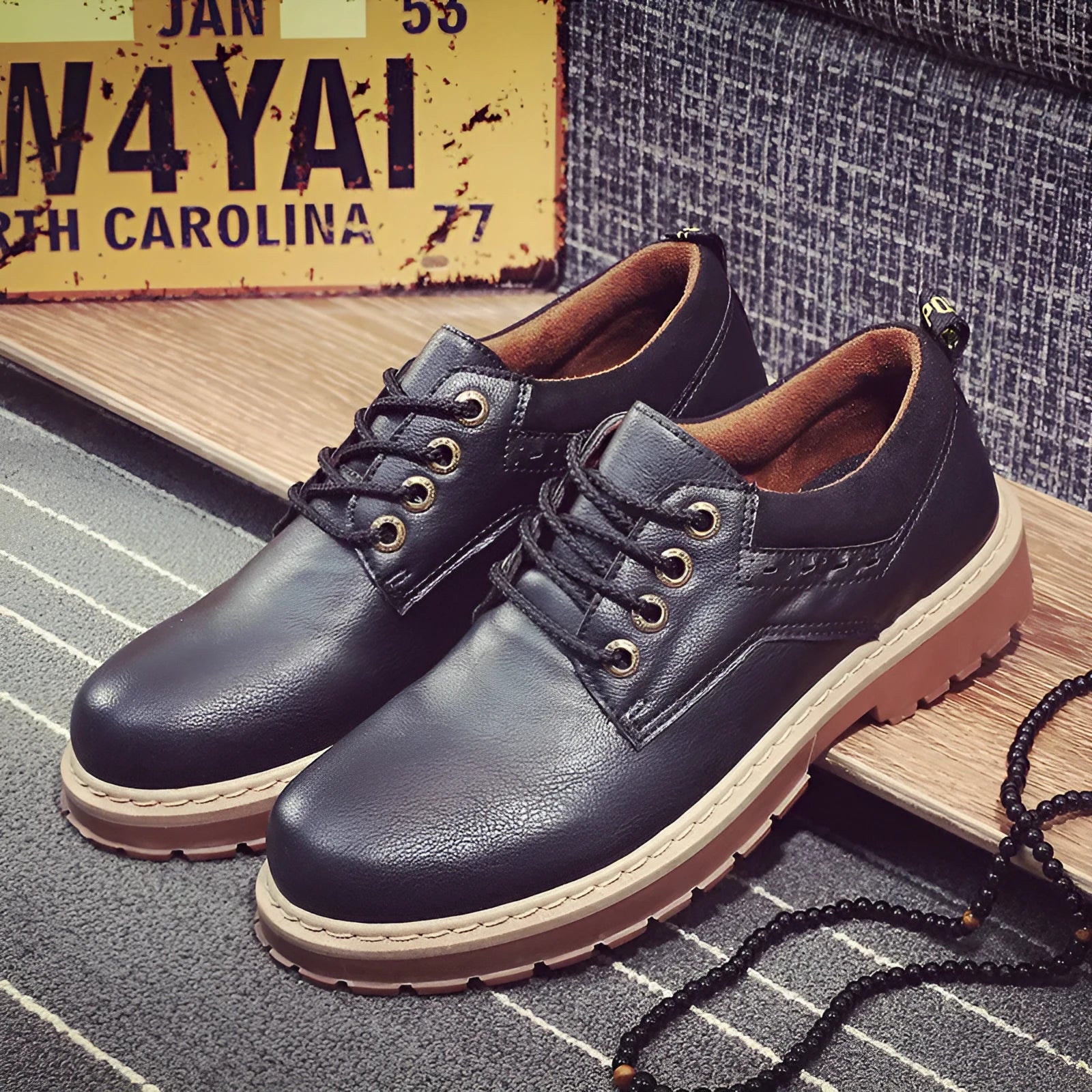 Men's black casual shoes with lace-up front and round toe design on rubber sole