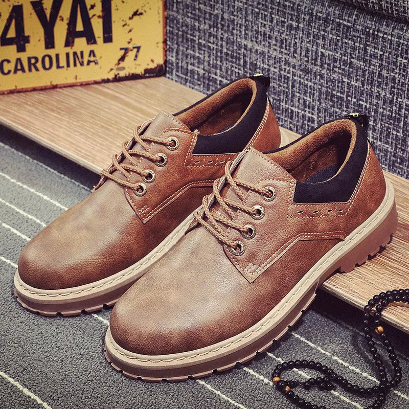 Men's black casual shoes with lace-up front and round toe design on rubber sole