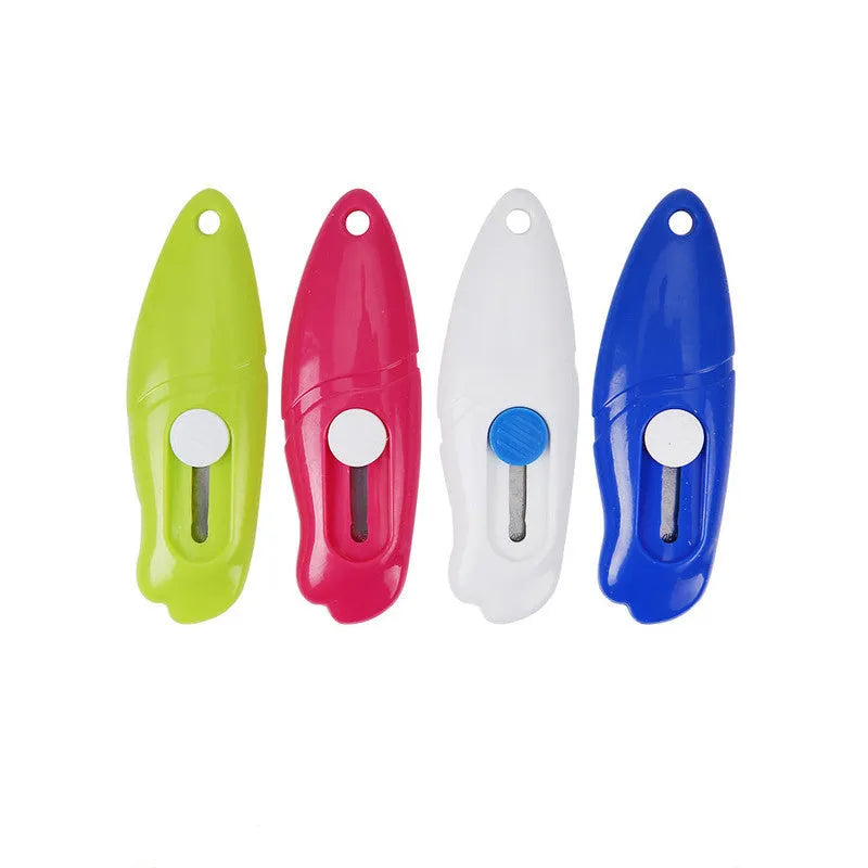 Cartoon character art knife with plastic handle and metal blade for manual production