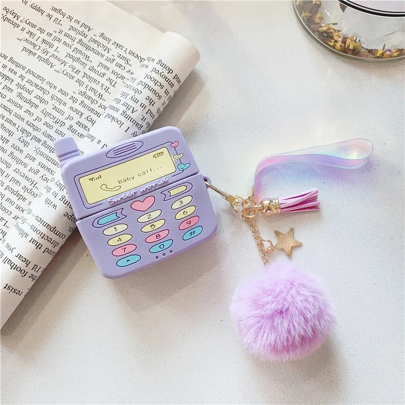 Purple silicone case for Apple AirPods with clamshell closure and fur ball pendant