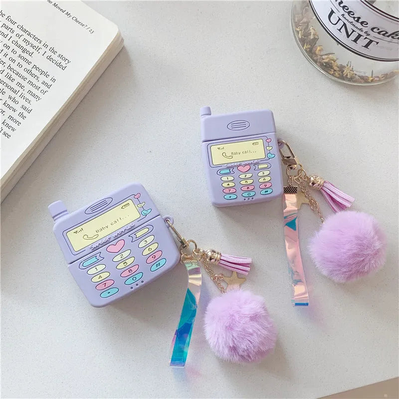 Purple silicone case for Apple AirPods with clamshell closure and fur ball pendant