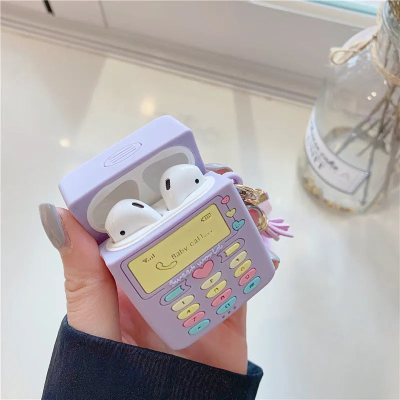 Purple silicone case for Apple AirPods with clamshell closure and fur ball pendant