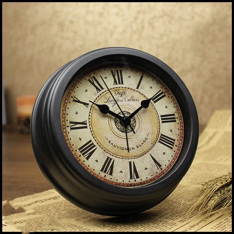 Round retro European desk clock with a 6-inch dial on a wooden surface.