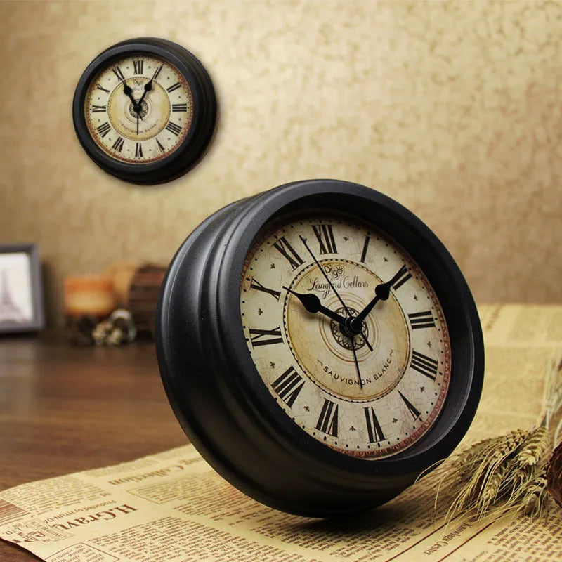Round retro European desk clock with a 6-inch dial on a wooden surface.