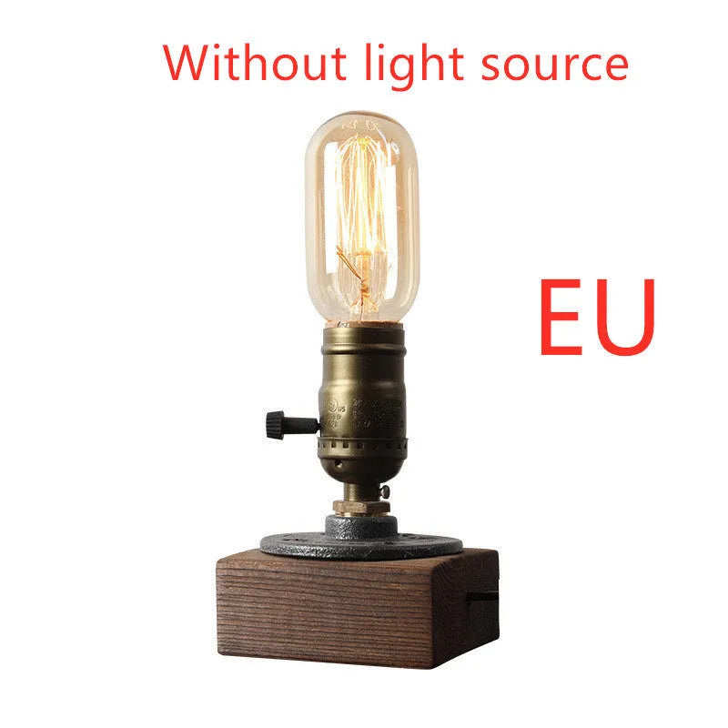 Industrial water pipe table lamp with wood and iron construction on tabletop