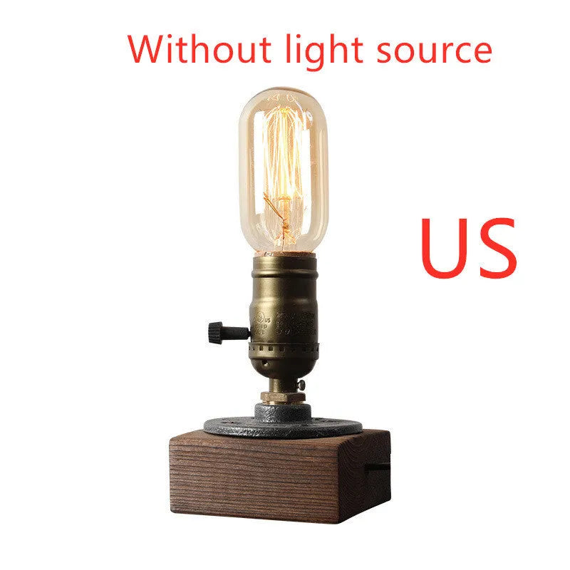 Industrial water pipe table lamp with wood and iron construction on tabletop