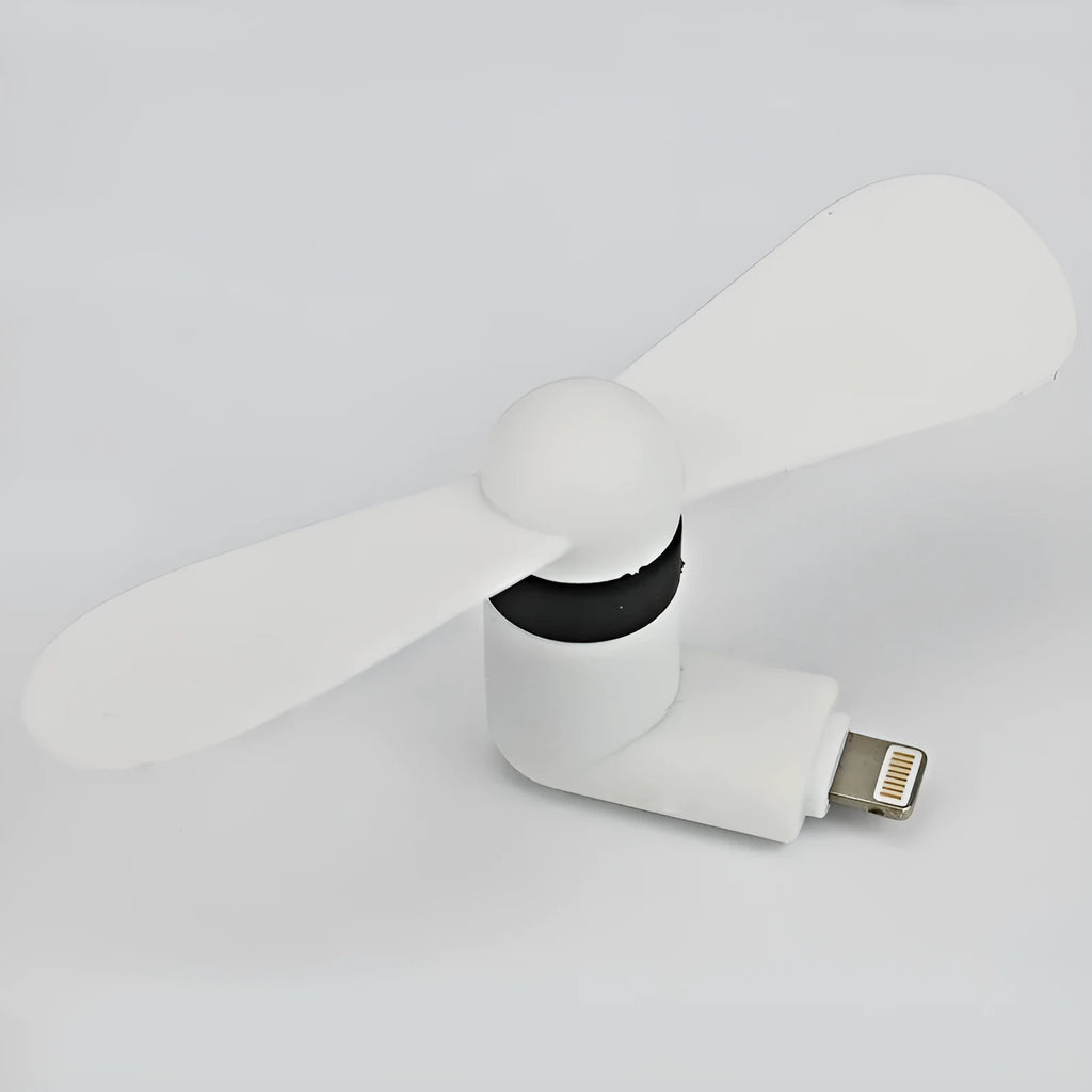 White portable mini fan with plastic blades and rotary switch attached to a mobile phone.