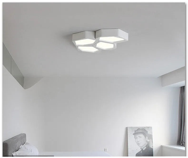 Geometric shaped iron LED ceiling light with remote control on a white ceiling