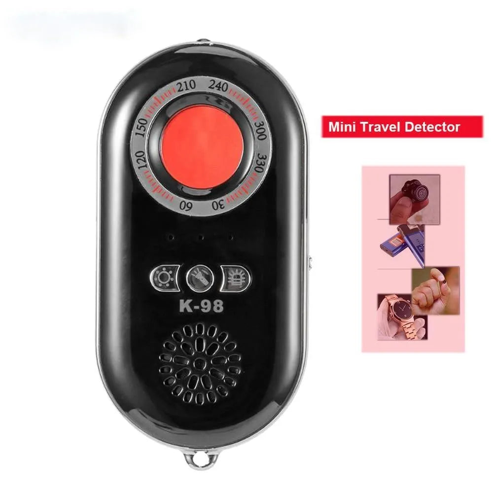Compact black wireless security alarm detector with USB charging port, shown next to a ruler for scale.