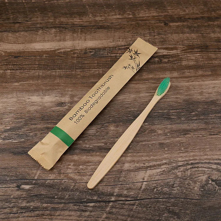 Set of ten bamboo toothbrushes with charcoal-infused bristles in assorted colours on a white background.