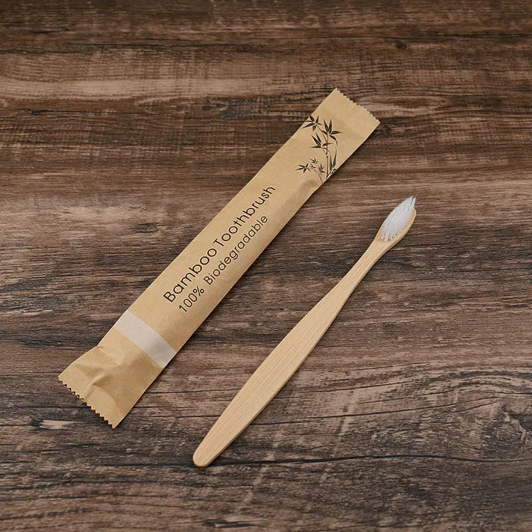 Set of ten bamboo toothbrushes with charcoal-infused bristles in assorted colours on a white background.