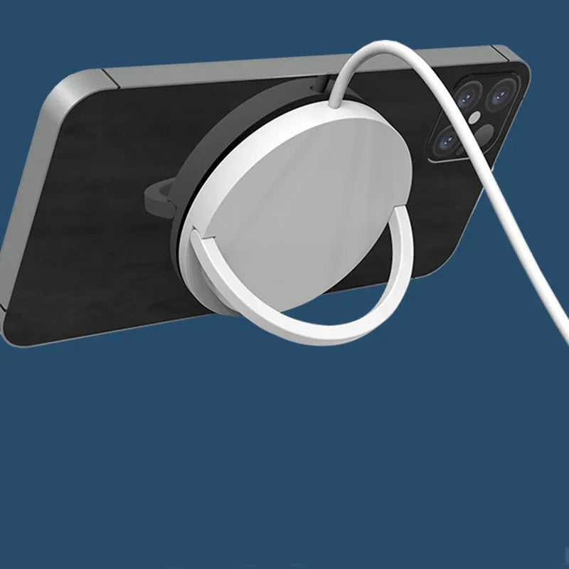 Black magnetic wireless charging bracket holding mobile phone with TYPE-C cable connection