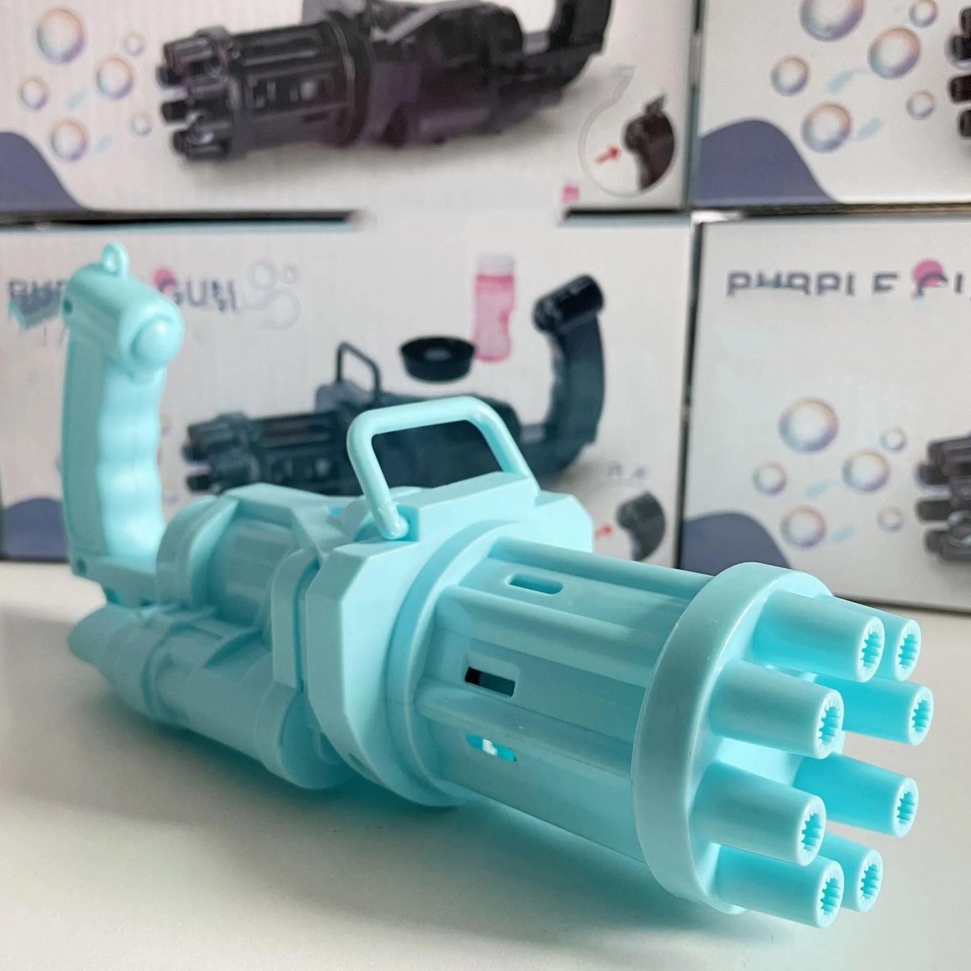 Kids handheld bubble machine gun toy in pink, gold, or black colours with removable bubble head.