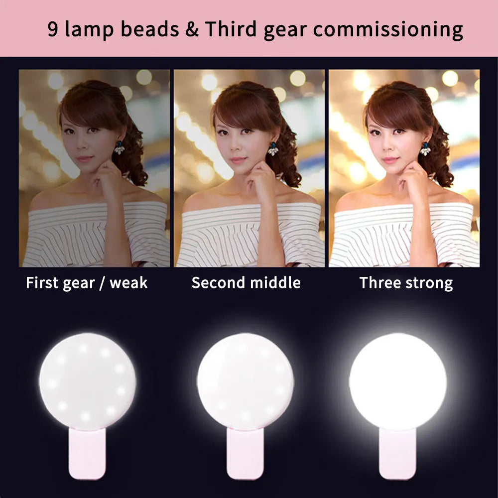 Mini round clip-on LED fill light attached to mobile phone for selfie photography